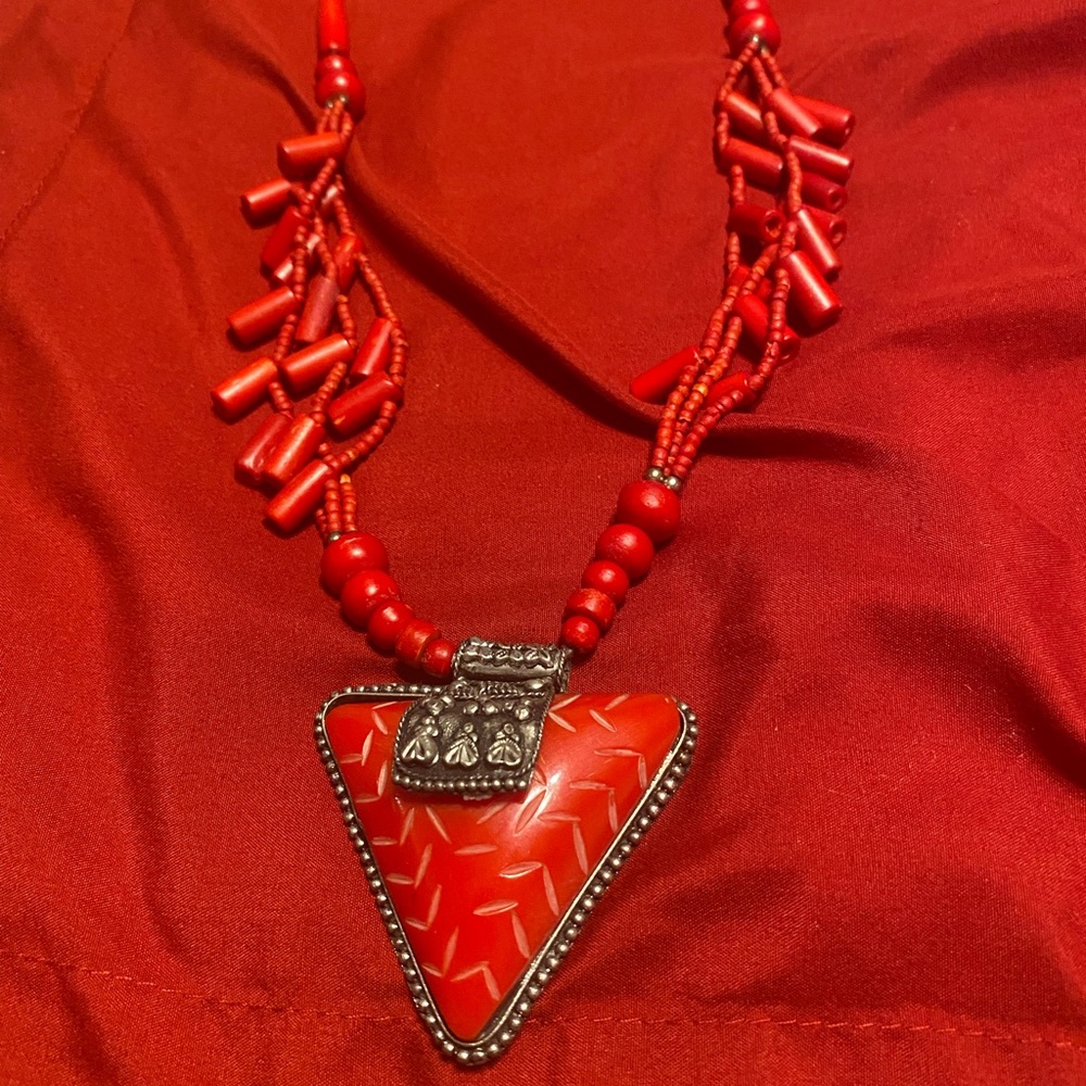Necklaces Red, with silver trim, and wooden beads.